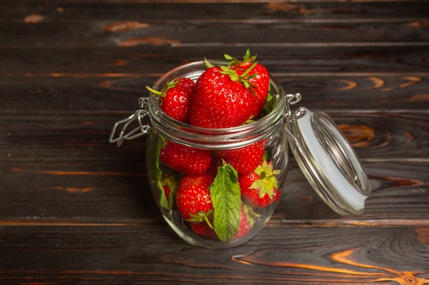 Fresh strawberries for jam in a jar