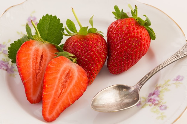 Fresh strawberries on old plate