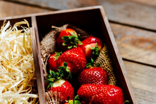 Fresh strawberries on a wooden background