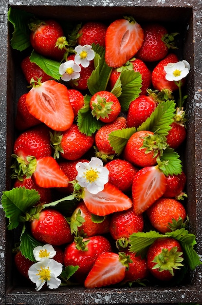 Fresh strawberries in a wooden box Berries Top view Free space for your text