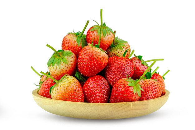 Fresh strawberries in a wooden dish isolated