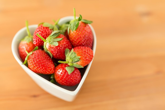 Fresh Strawberry in heart shape bowl