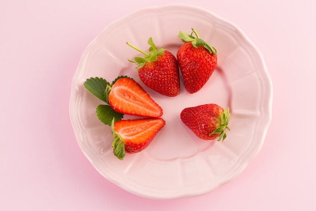 Fresh strawberry isolated on a pink surface