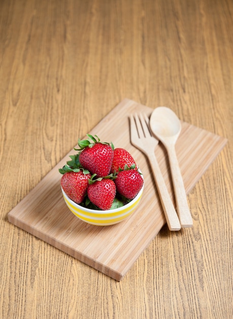 Fresh strawberry and juice on wood table. flat lay.