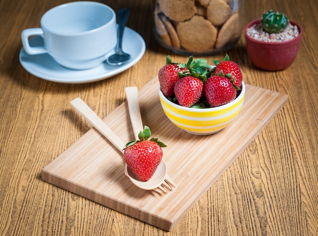 Fresh strawberry and juice on wood table. flat lay.