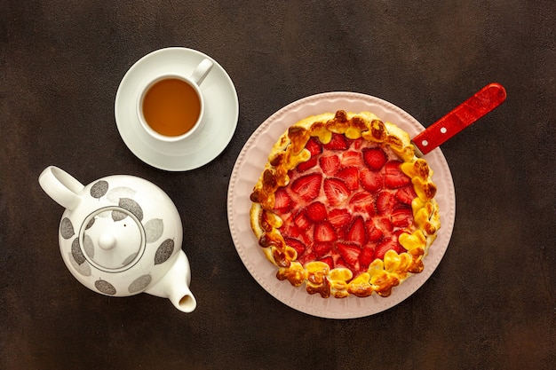 Fresh strawberry pie for breakfast with green tea