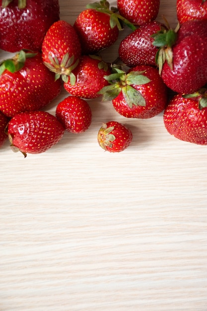 Fresh strawberry on wood . Top view