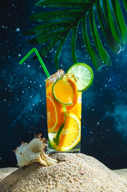 Fresh summer cocktail with lime and oranges