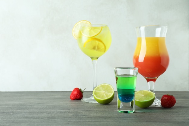 Fresh summer cocktails on gray textured table