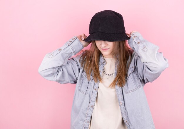 Fresh summer girl in denim shirt and black panama hat. Party monochrome vanilla style. Minimal design trends