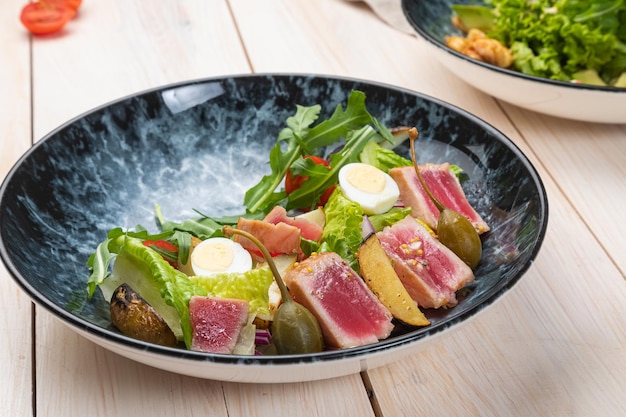 Fresh summer light salad with tuna and arugula