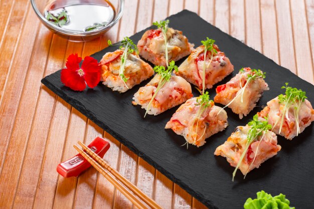 Fresh sushi on rustic wooden table