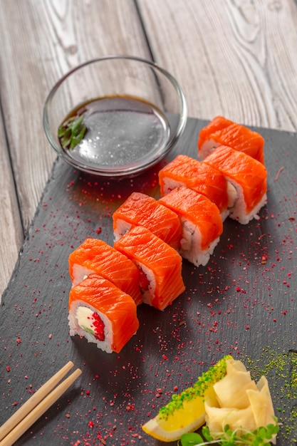 Fresh sushi on rustic wooden table