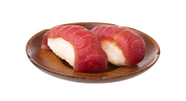 fresh sushi on a wooden dish isolated on white background