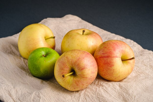 Fresh sweet apples on reusable textile grocery bag