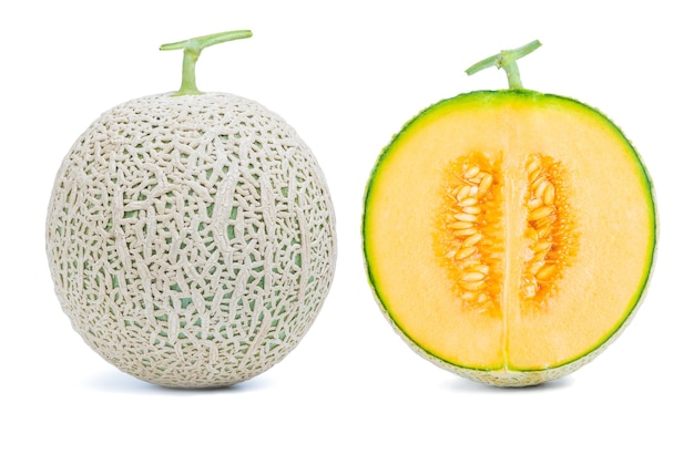 Photo fresh sweet green melon whole and cut in half isolate on over white background