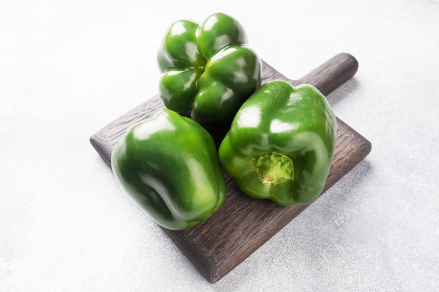 Fresh sweet green pepper on a grey concrete