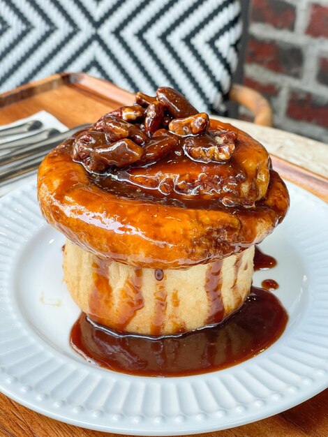 Fresh sweet homemade Brioche bread topped with pecan nut and caramel in French style