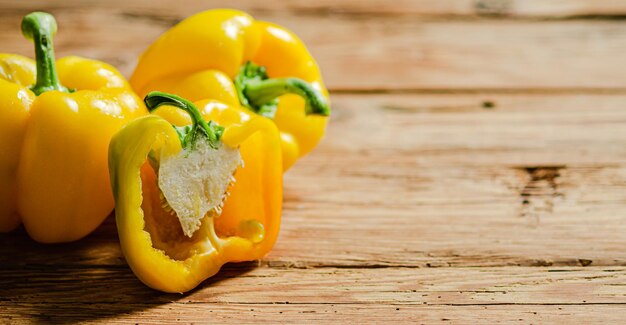 Fresh sweet pepper on a wooden table