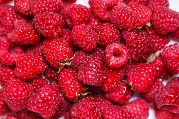 Fresh and sweet raspberries background