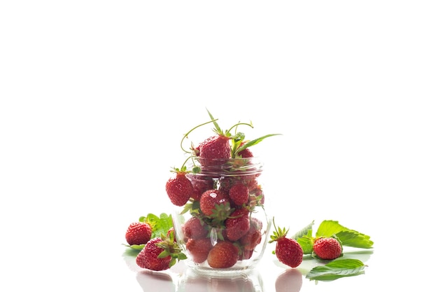 fresh sweet red strawberries in a glass jar