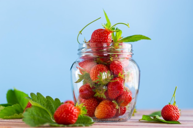 fresh sweet red strawberries in a glass jar