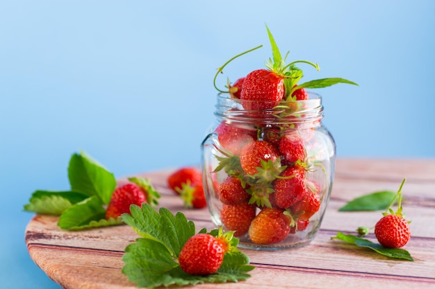 fresh sweet red strawberries in a glass jar