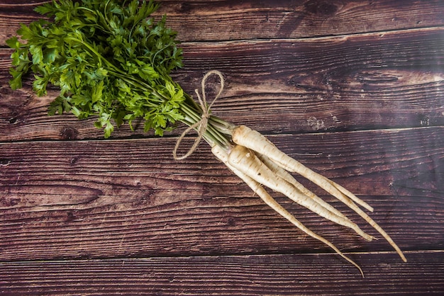 fresh and sweet white parsley on a wooden table from small village garden