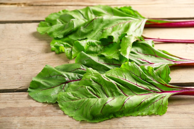 Fresh swiss chard on wooden table close up