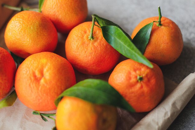 Fresh tangerines with green leaves