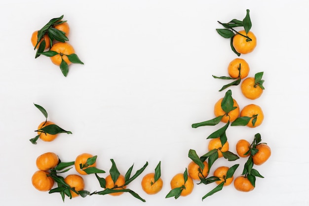 Fresh tangerines with green leaves