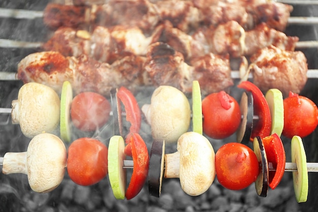 Fresh tasty barbecue with vegetables in brazier outdoors