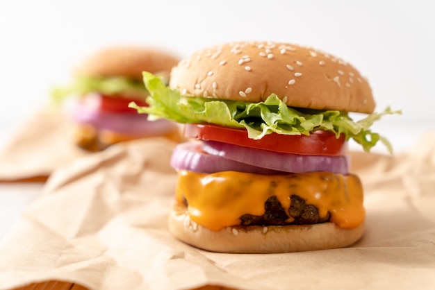 fresh tasty beef burger with cheese and french fries