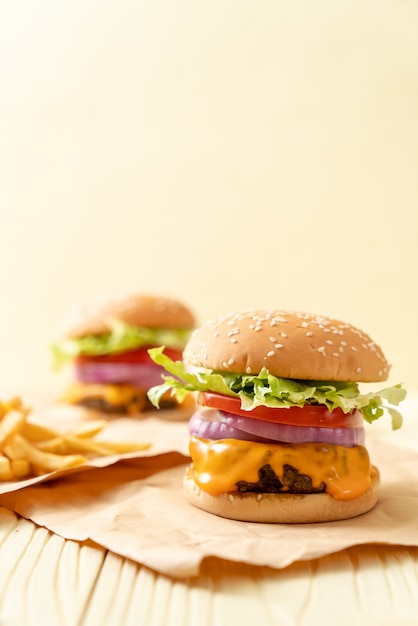 fresh tasty beef burger with cheese and french fries