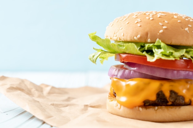 fresh tasty beef burger with cheese and french fries