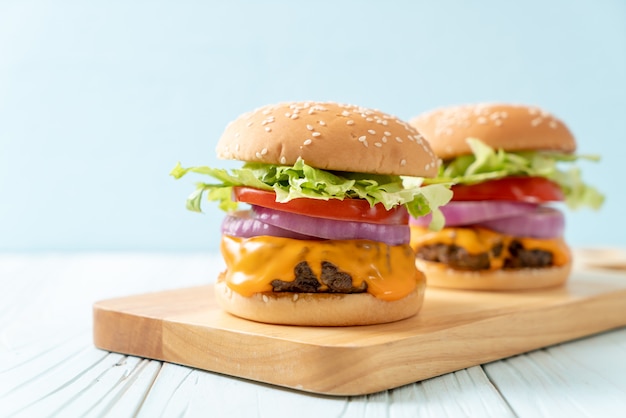 fresh tasty beef burger with cheese and french fries