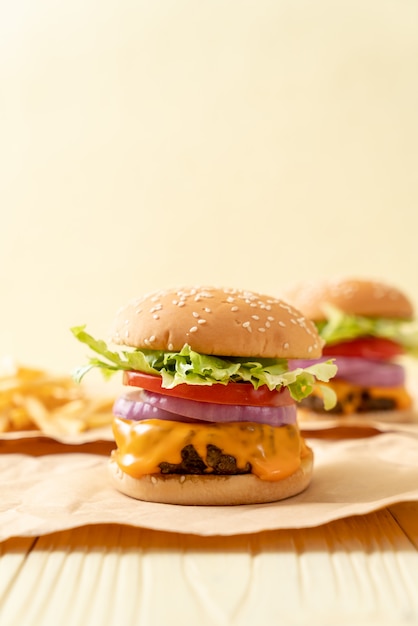 fresh tasty beef burger with cheese and french fries