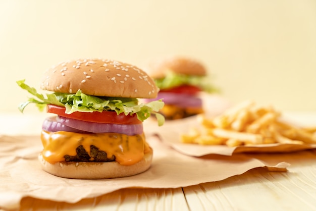 fresh tasty beef burger with cheese and french fries