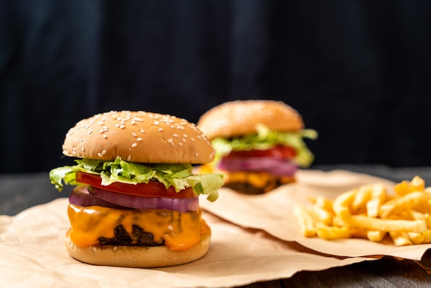 fresh tasty beef burger with cheese and french fries