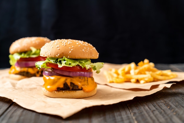 fresh tasty beef burger with cheese and french fries