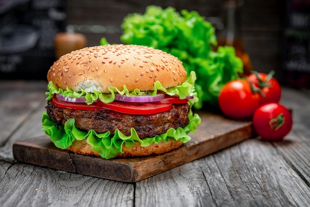 Fresh tasty burger on wood table