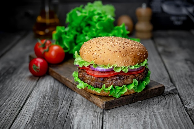 Fresh tasty burger on wood table