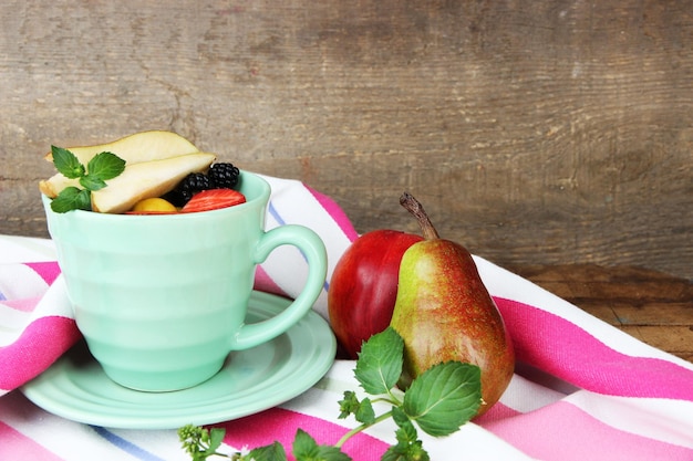 Fresh tasty fruit salad on table