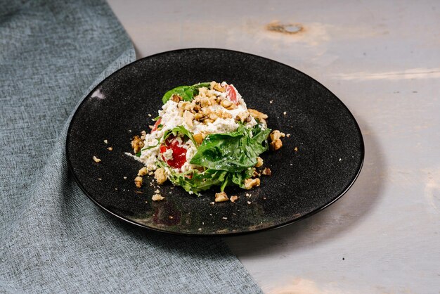 Fresh tasty green salad on the wooden background