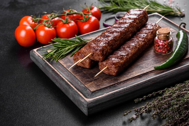 Fresh tasty kebab grilled with spices and herbs. Grilled meat dish