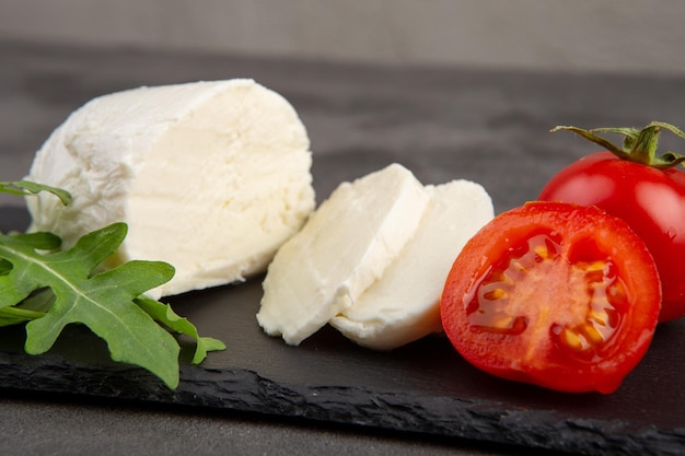 Fresh tasty mozzarella closeup Concrete grey background