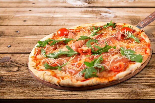 Fresh Tasty Pizza on wooden background