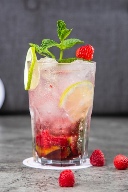 Fresh tasty raspberry mint and lemon Mojito