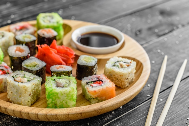 Fresh and tasty sushi on dark background. 