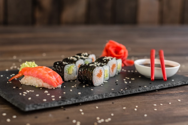 Fresh and tasty sushi on dark background. 